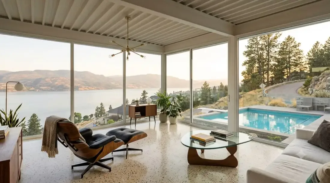 Stahl House — Glass-corner living room — Eames chair, Noguchi table, lake in two directions