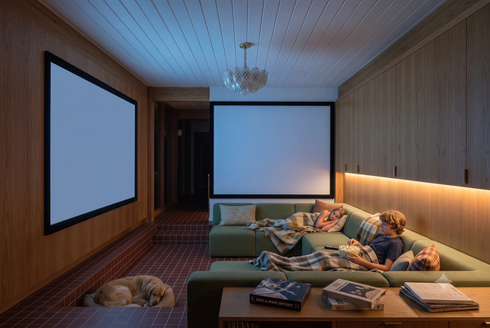 The media room, A drop screen over a deep sectional, the family piled in, blackout glass and low light.