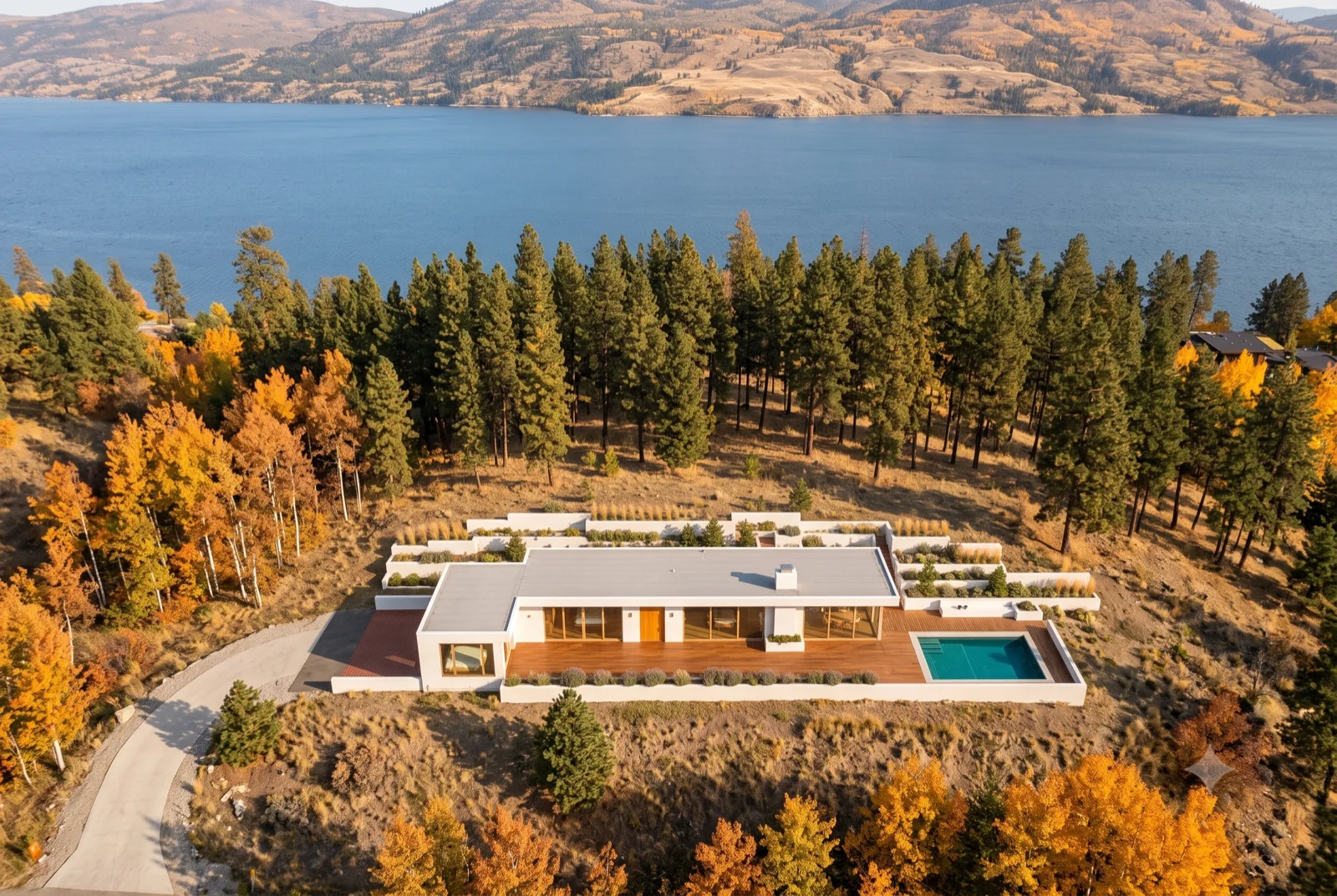 Larch and lake, Golden larches around the court, the pool bright against them, the valley falling away to the water.